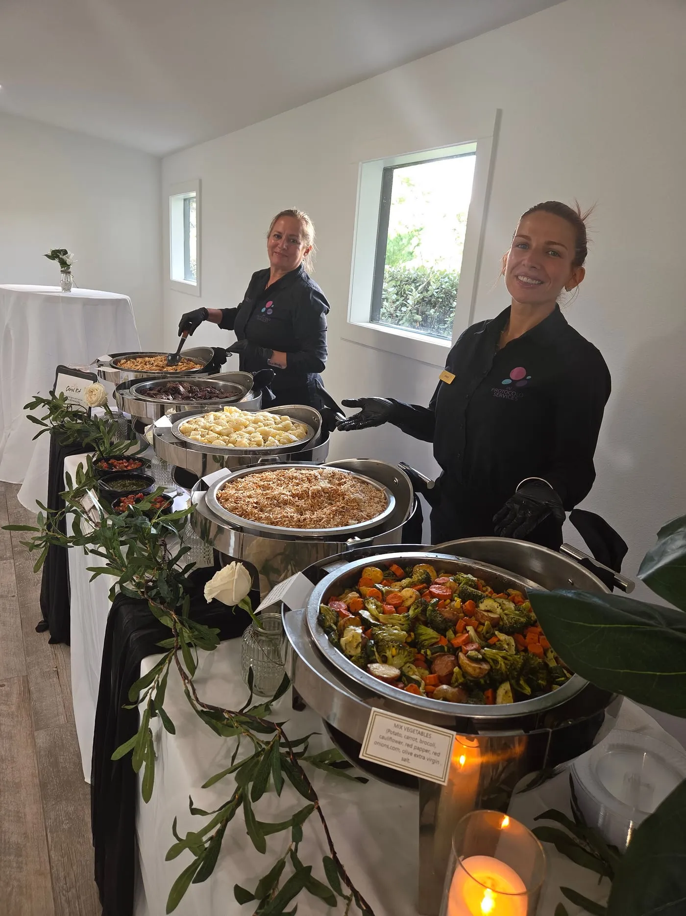 Service team beside the hot food stations
