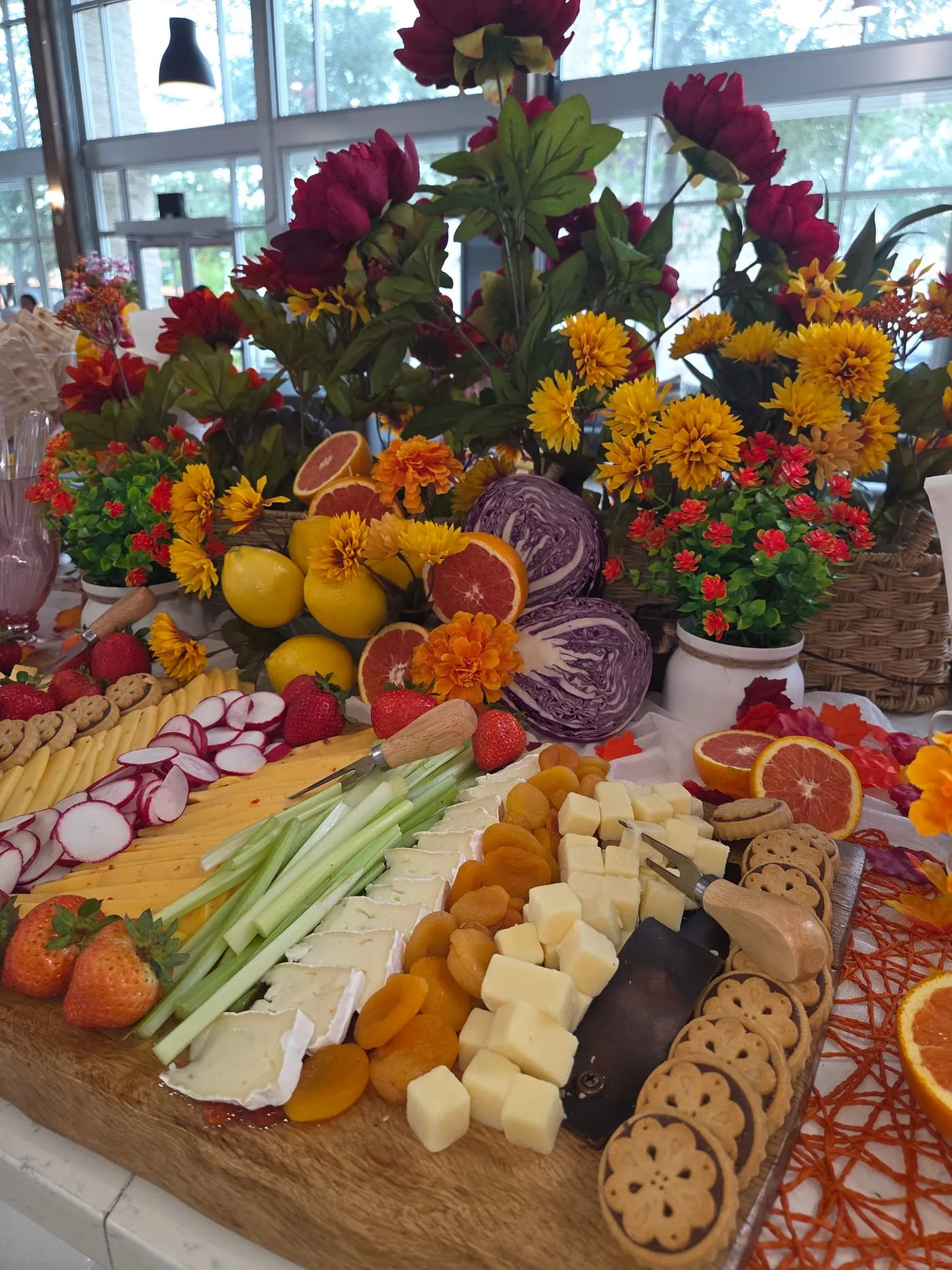 Board of fresh vegetables, fruit and cheeses
